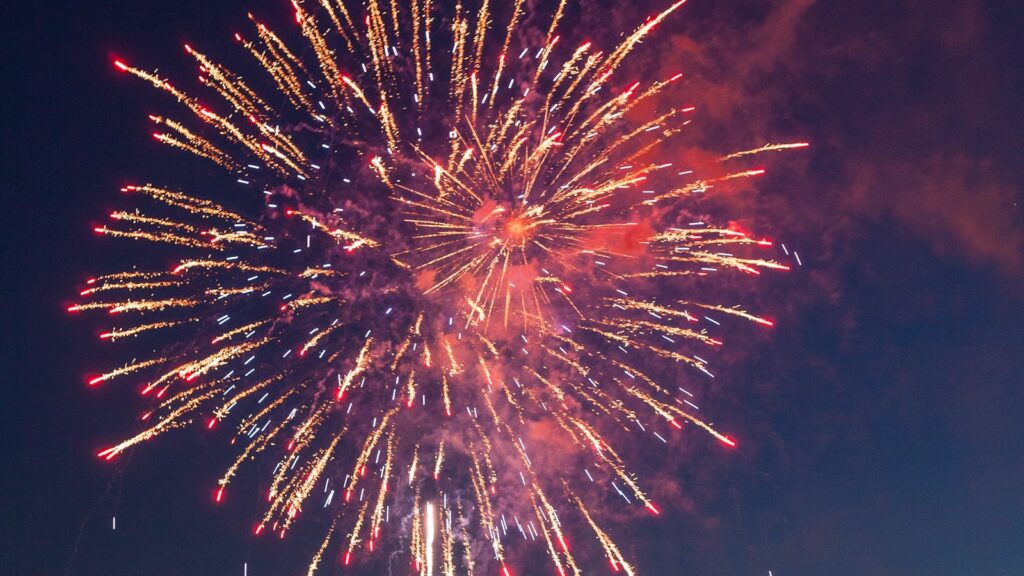 Fireworks lighting up a city skyline at night for the Fourth of July near Oak Cliff, Dallas